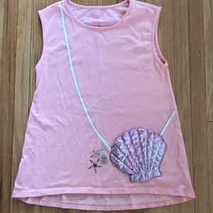 Pink sleeveless top with shiny shell pocket